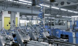 Synchronkettenzug GPS für Druckmaschine In einer Druckerei werden Papierrollen mit einem Synchronkettenzug gehoben