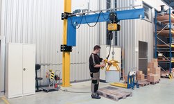Slewing crane with grab for lifting boxes