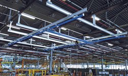 Crane system ensures safe flow of goods between the work stations